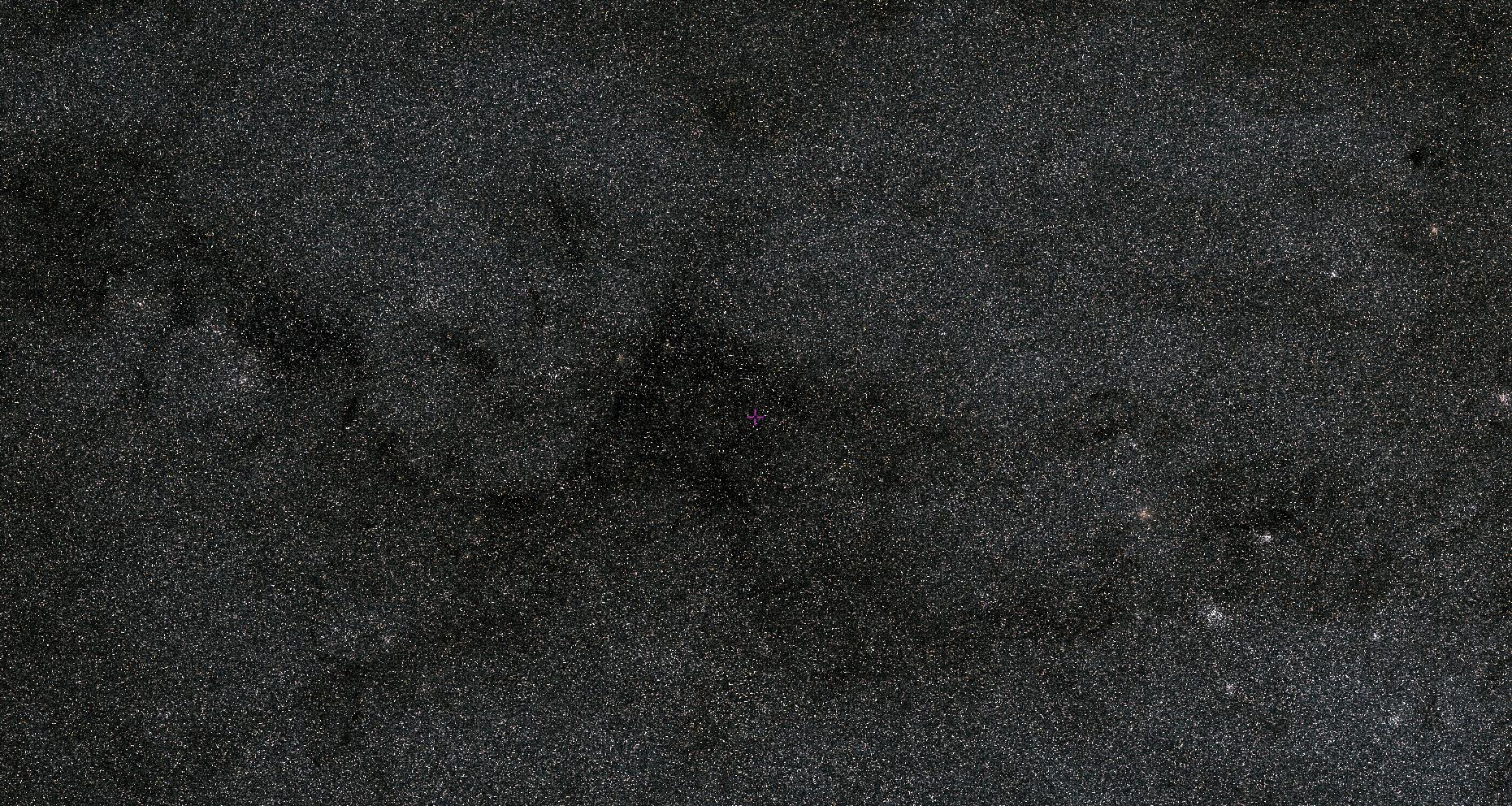 A star-filled patch of space, captured by JWST, with a small pink dot near the center, set against the vast expanse of the Milky Way.